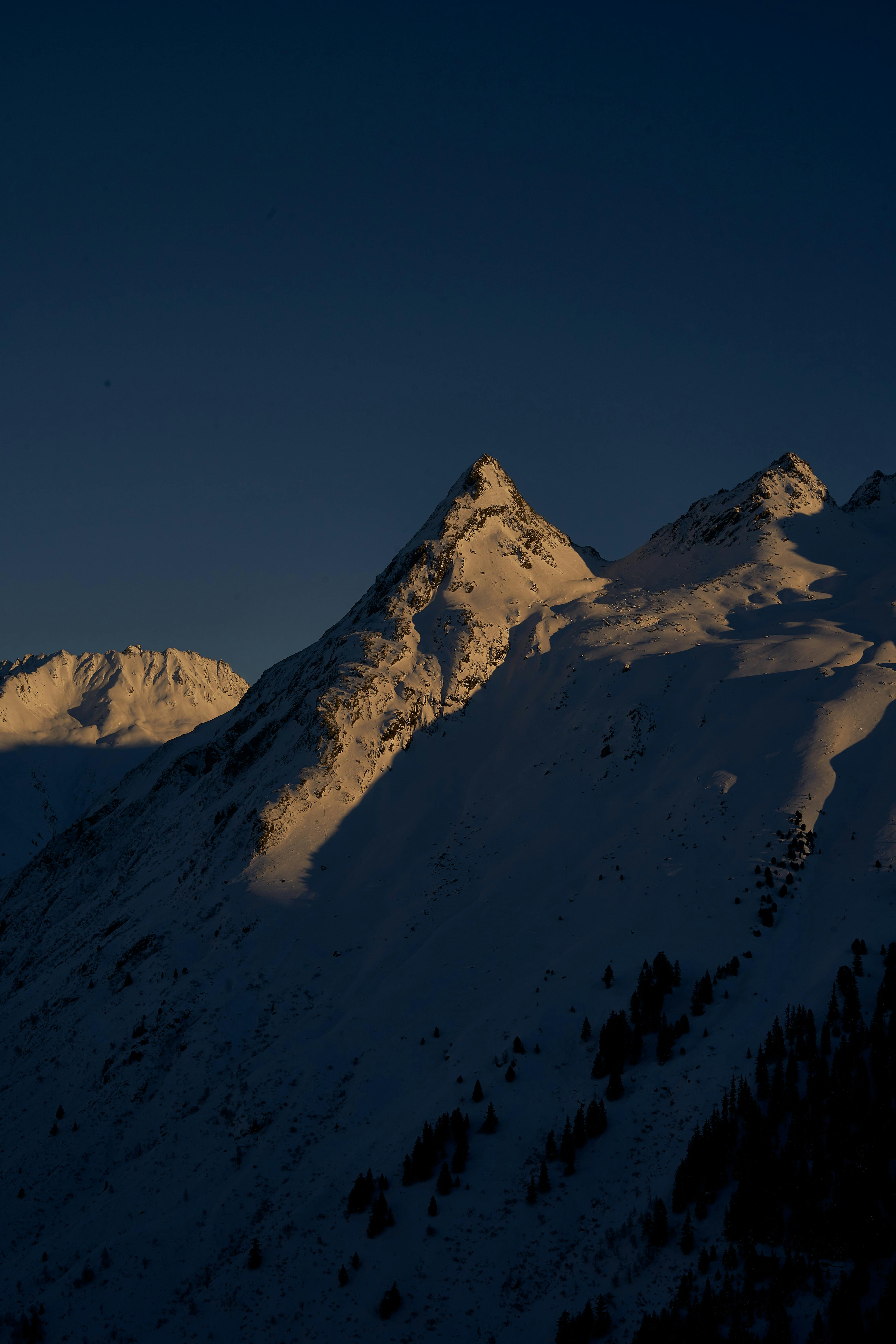 Low-angle cityscape with reflections creating a dramatic composition