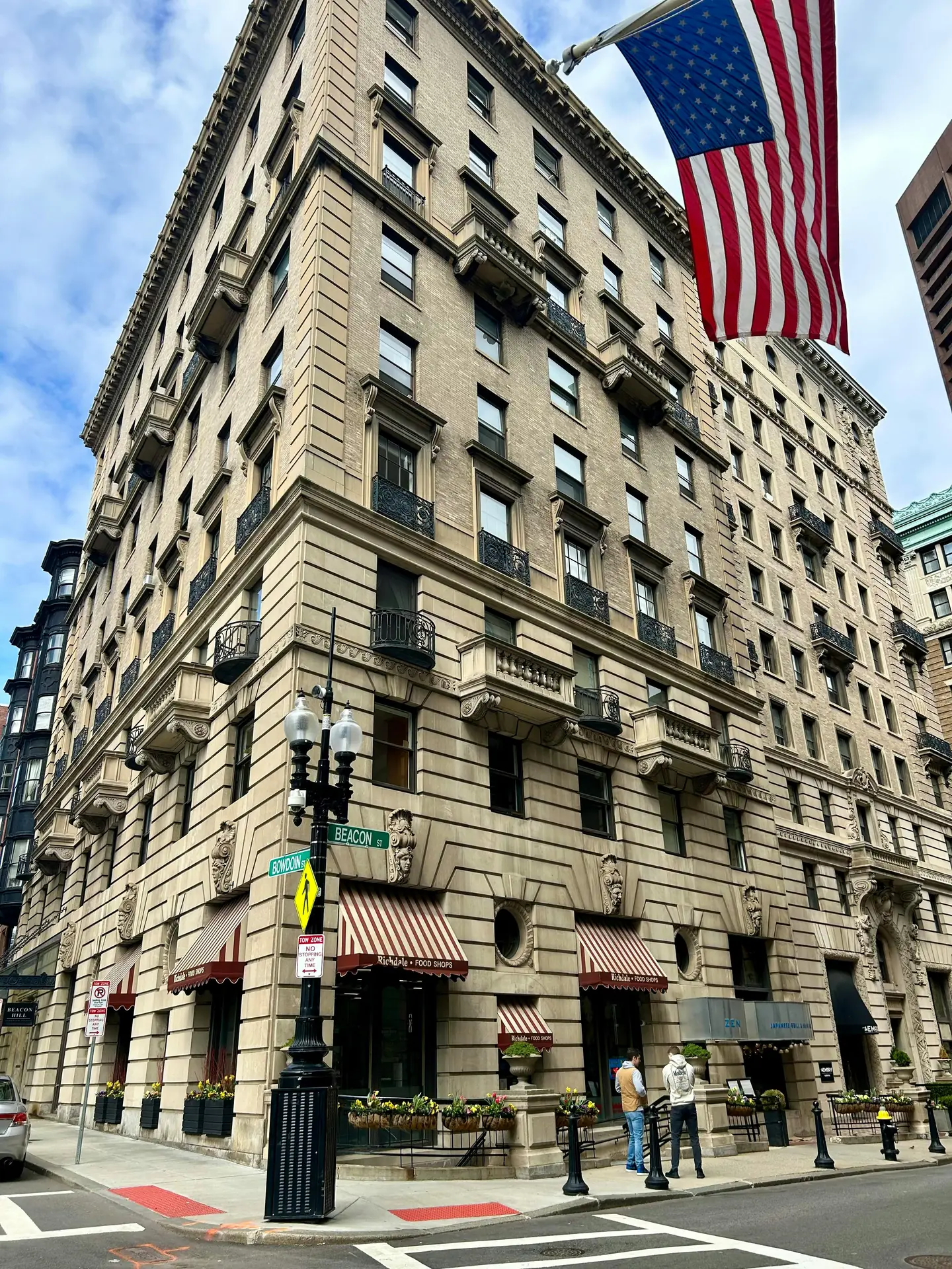 Traveler with a compact camera walking through a city street