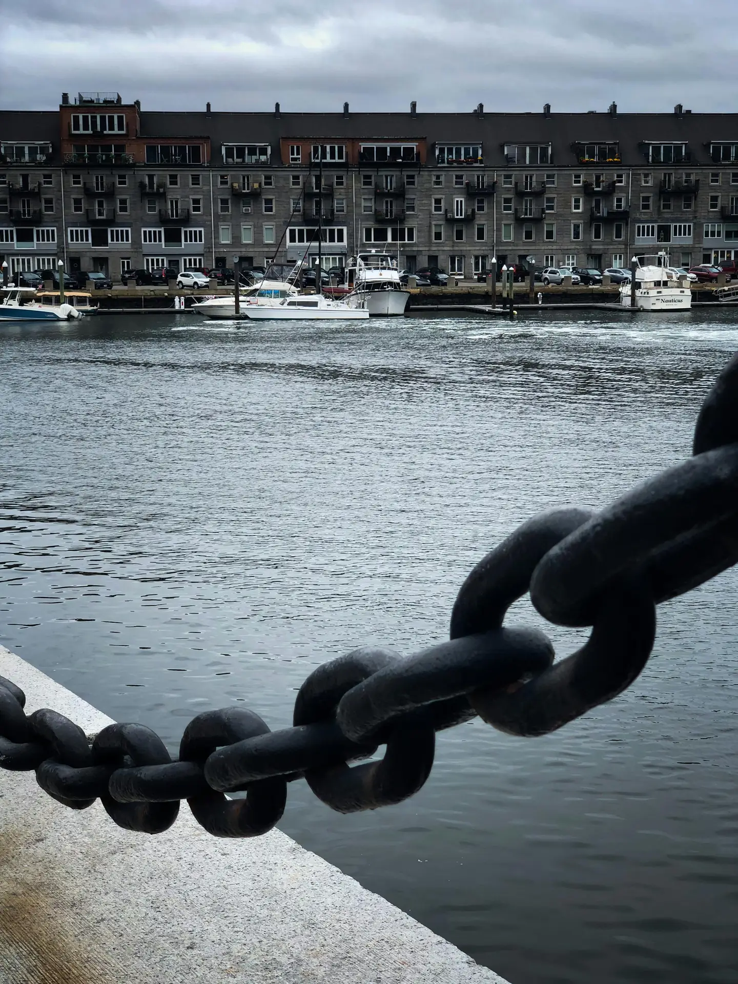 Compact camera on a small strap with urban background