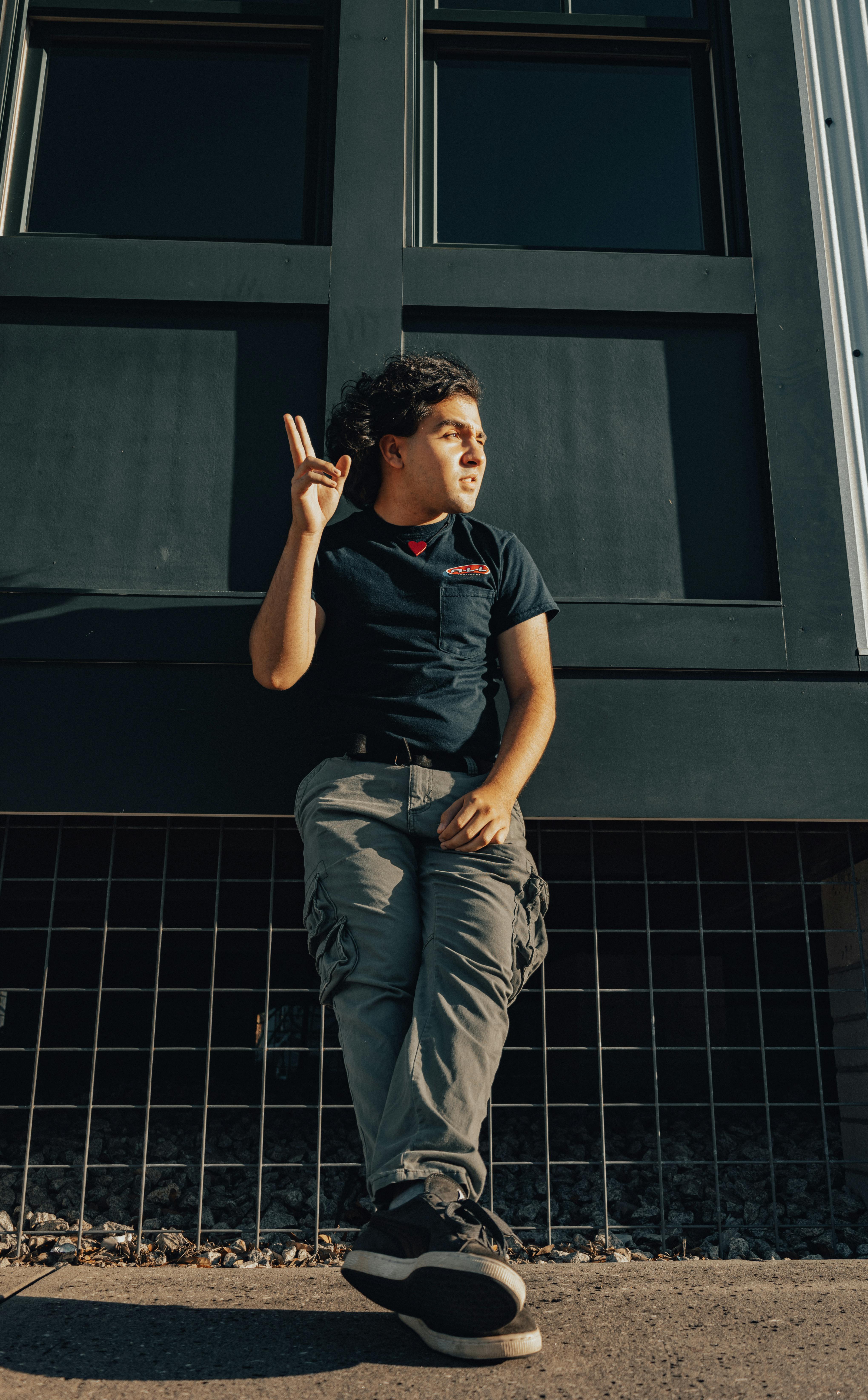 Traveler holding a compact camera with a relaxed lo-fi aesthetic