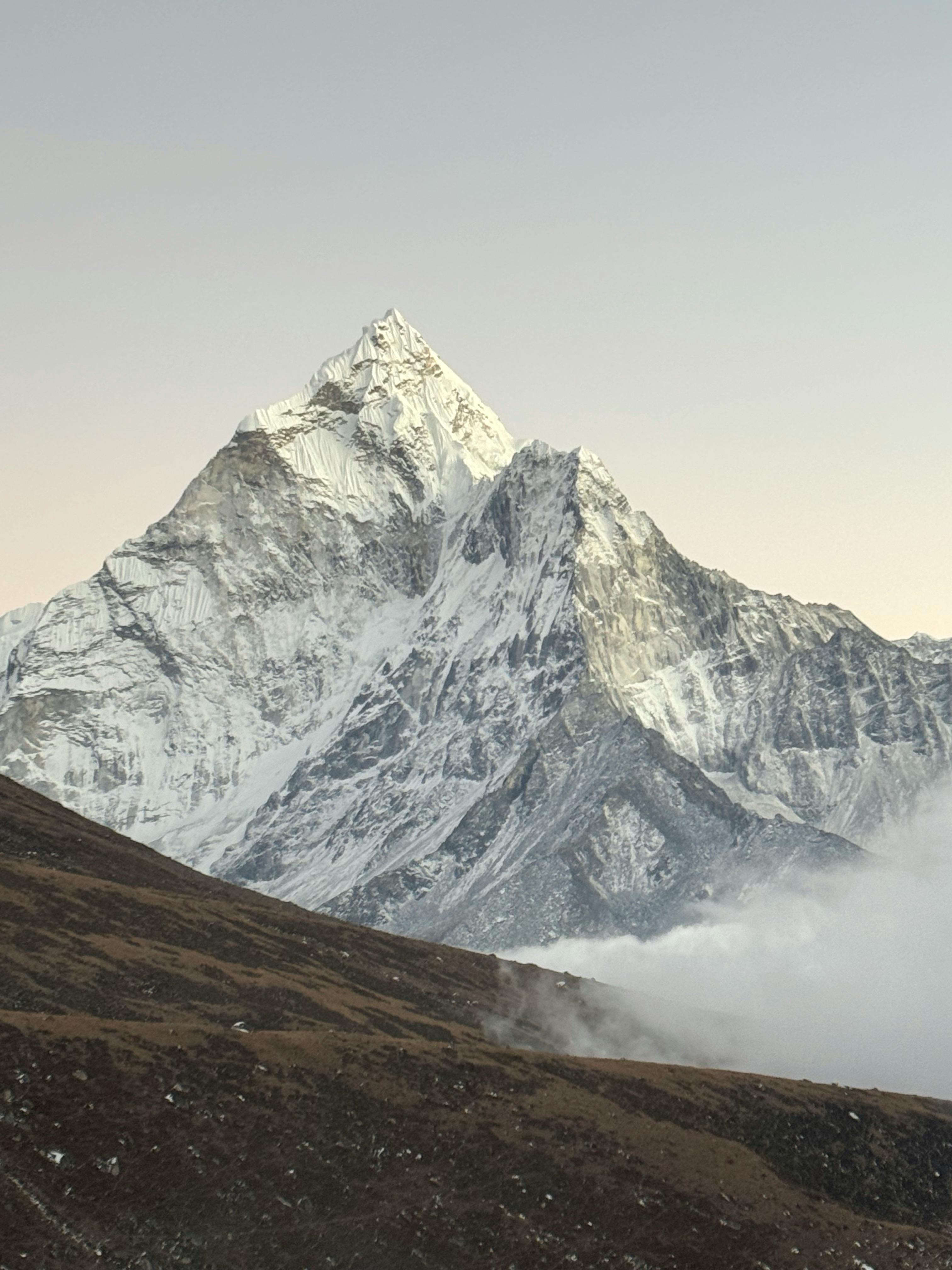 High-contrast mountain landscape with bright highlights and deep shadows