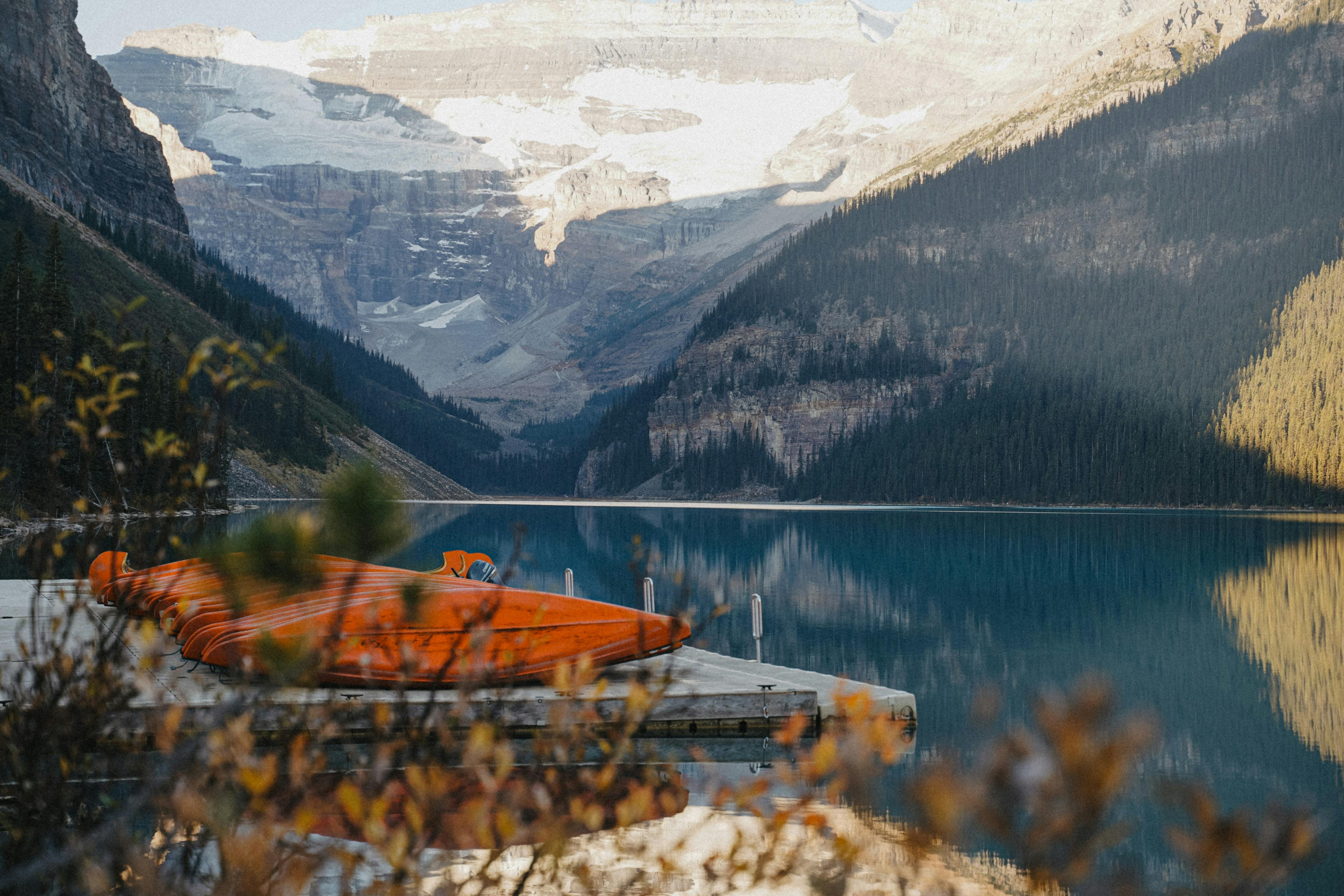 Editing RAW files on a laptop with histogram and masks visible