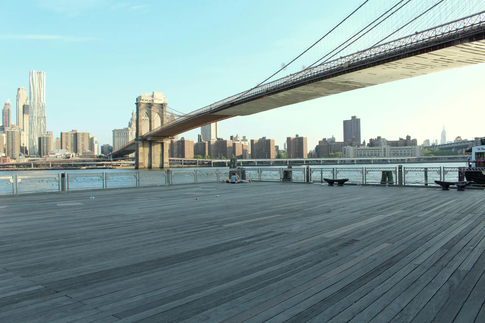 Close-up of a stock camera strap attached to a DSLR