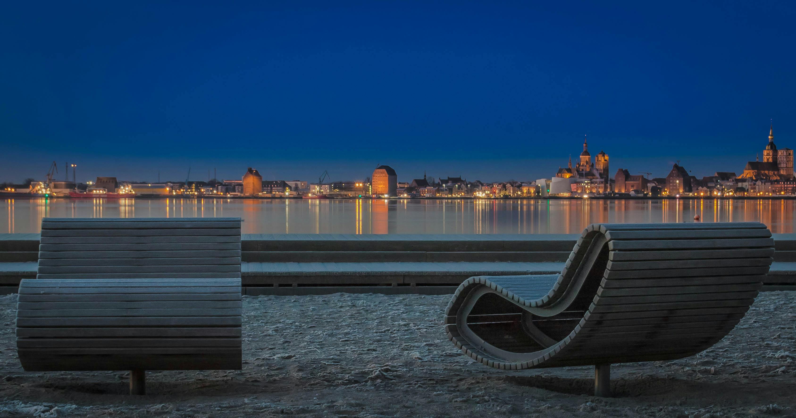 Compact camera and travel tripod laid out on a map