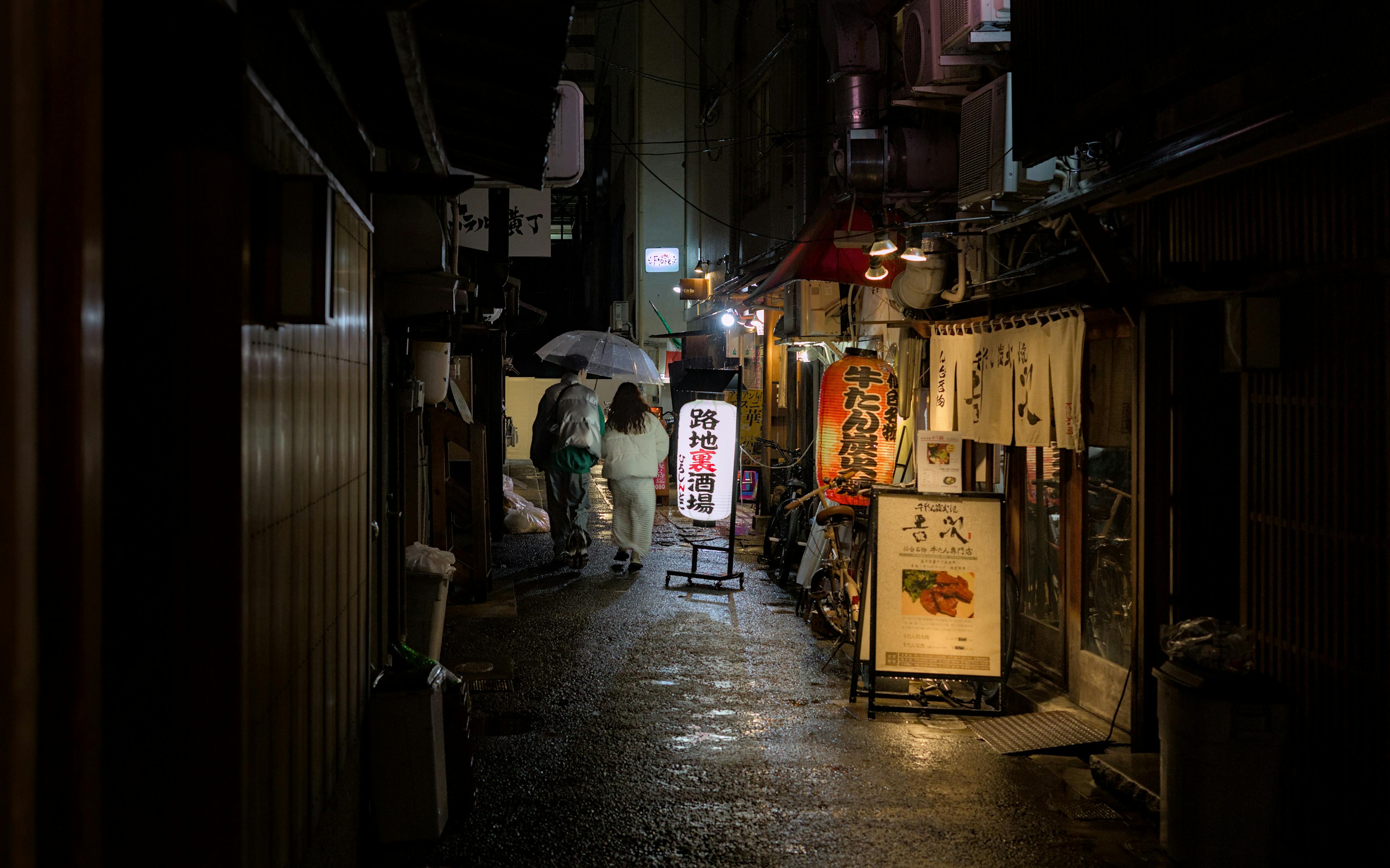 Long exposure city street at night with light trails