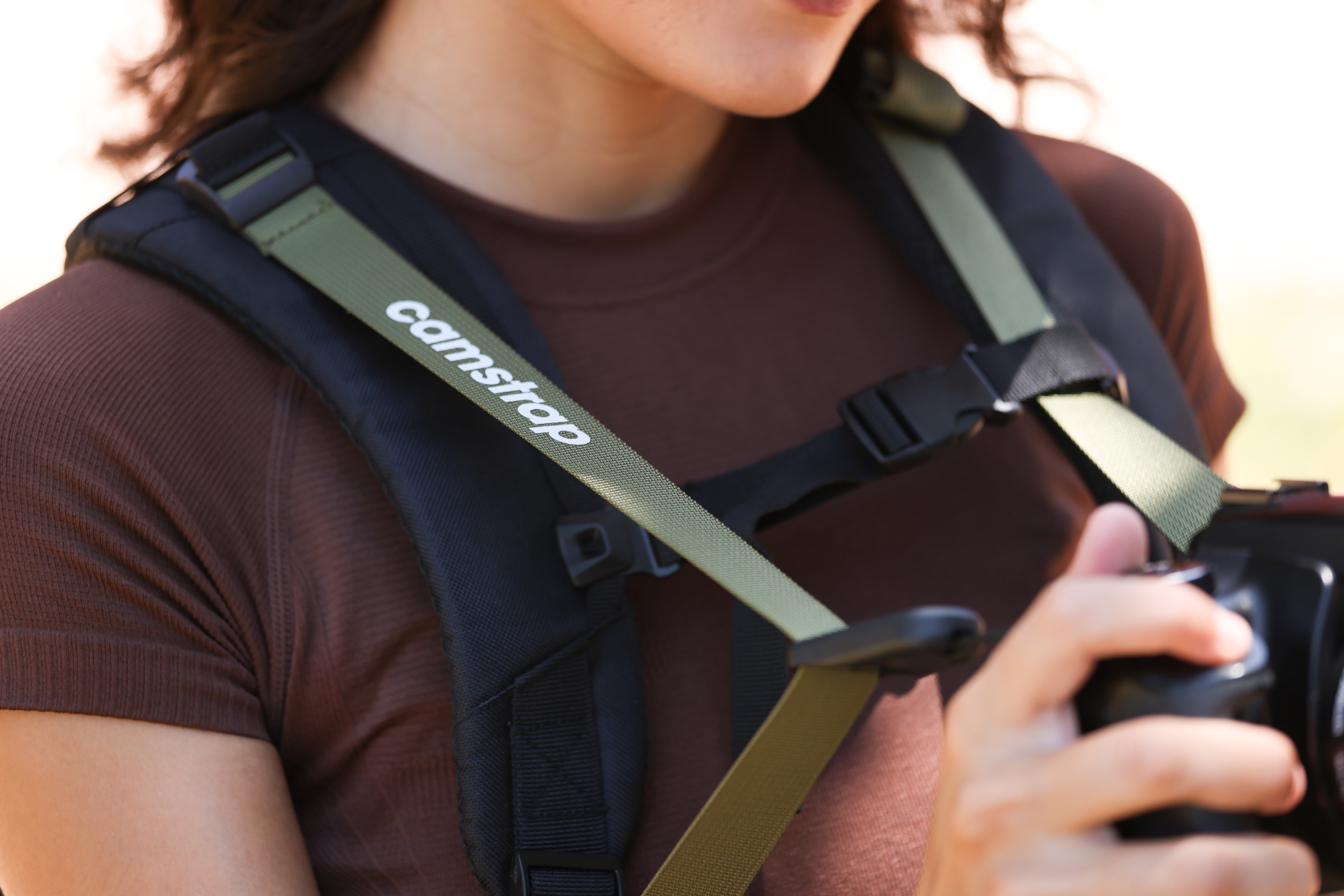 Travel enthusiast exploring a European street with a small camera and backpack