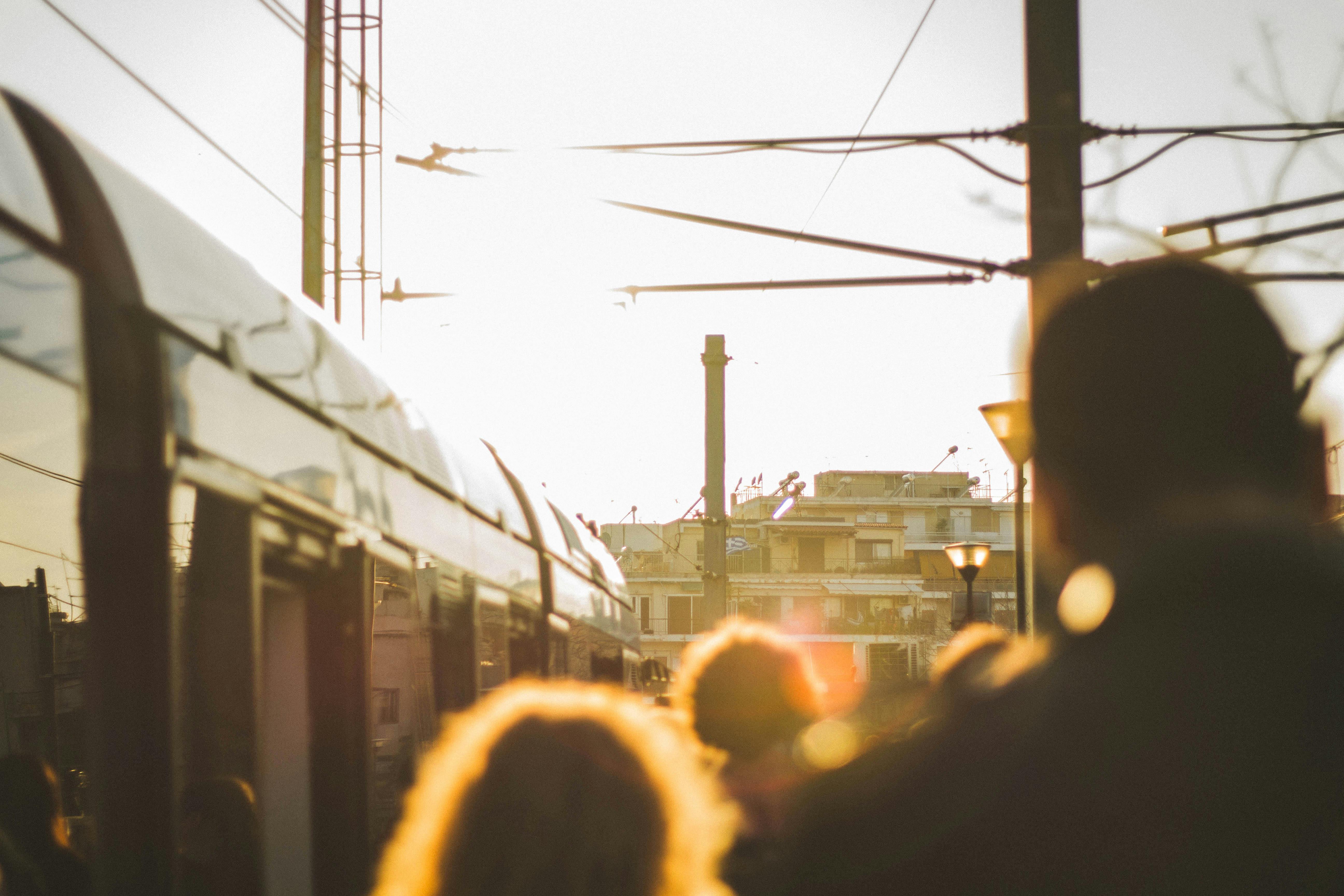 Photographer blending into a crowd with camera hanging naturally on a strap
